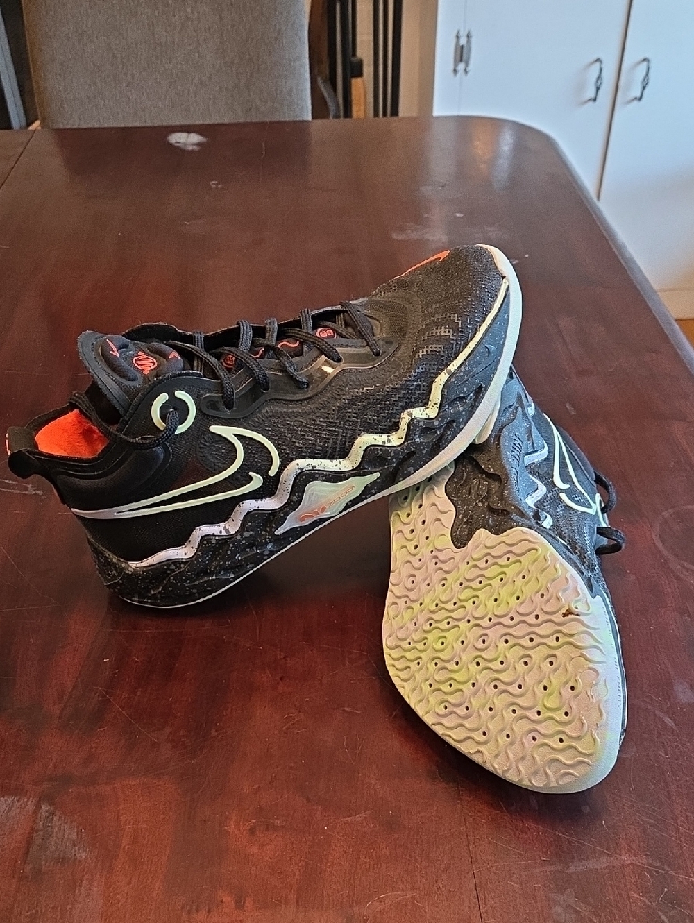 Nike Air Zoom GT Run basketball shoes in the Black/Ghost-Hyper Crimson colorway.